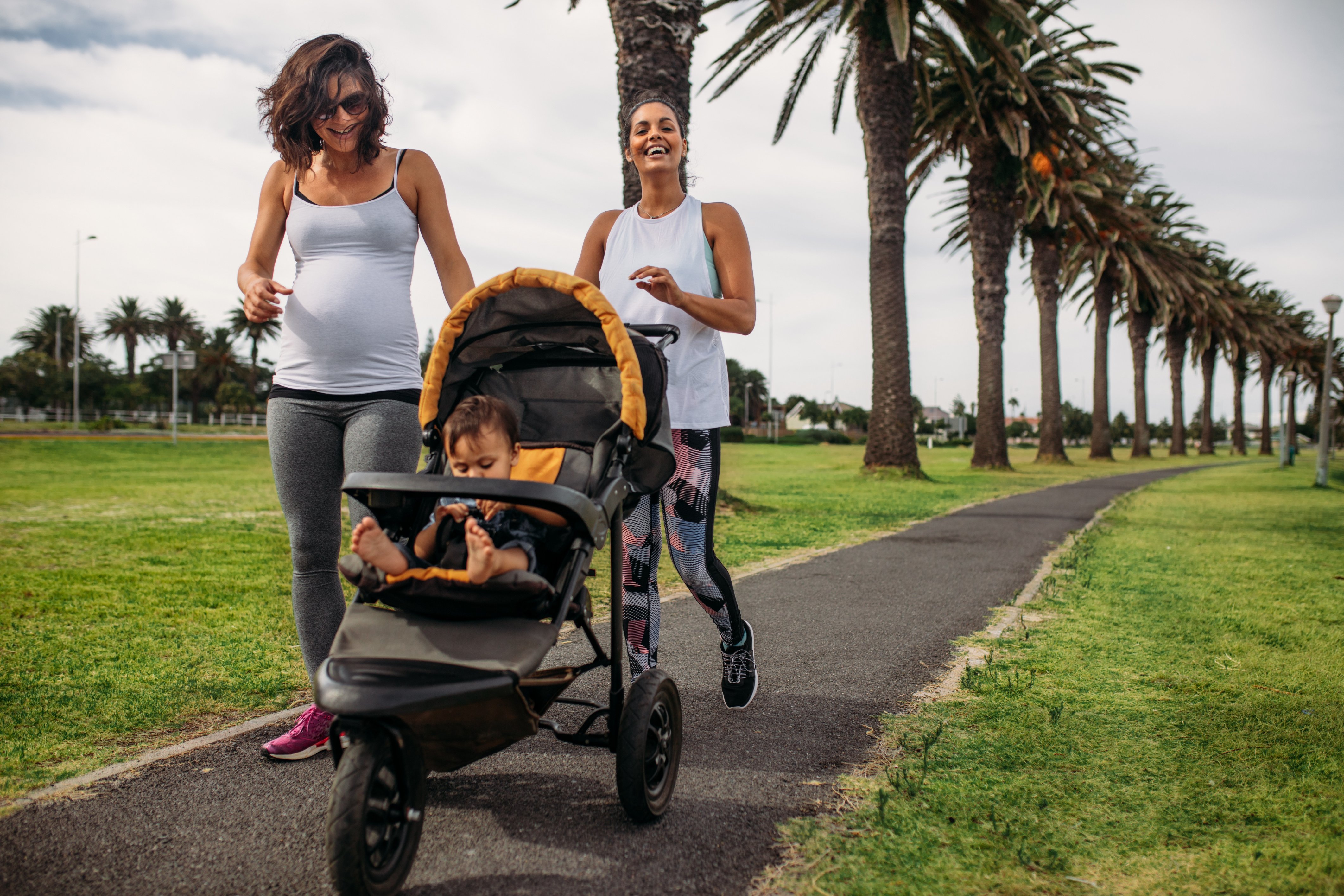 Women Walking with Baby in a Stroller